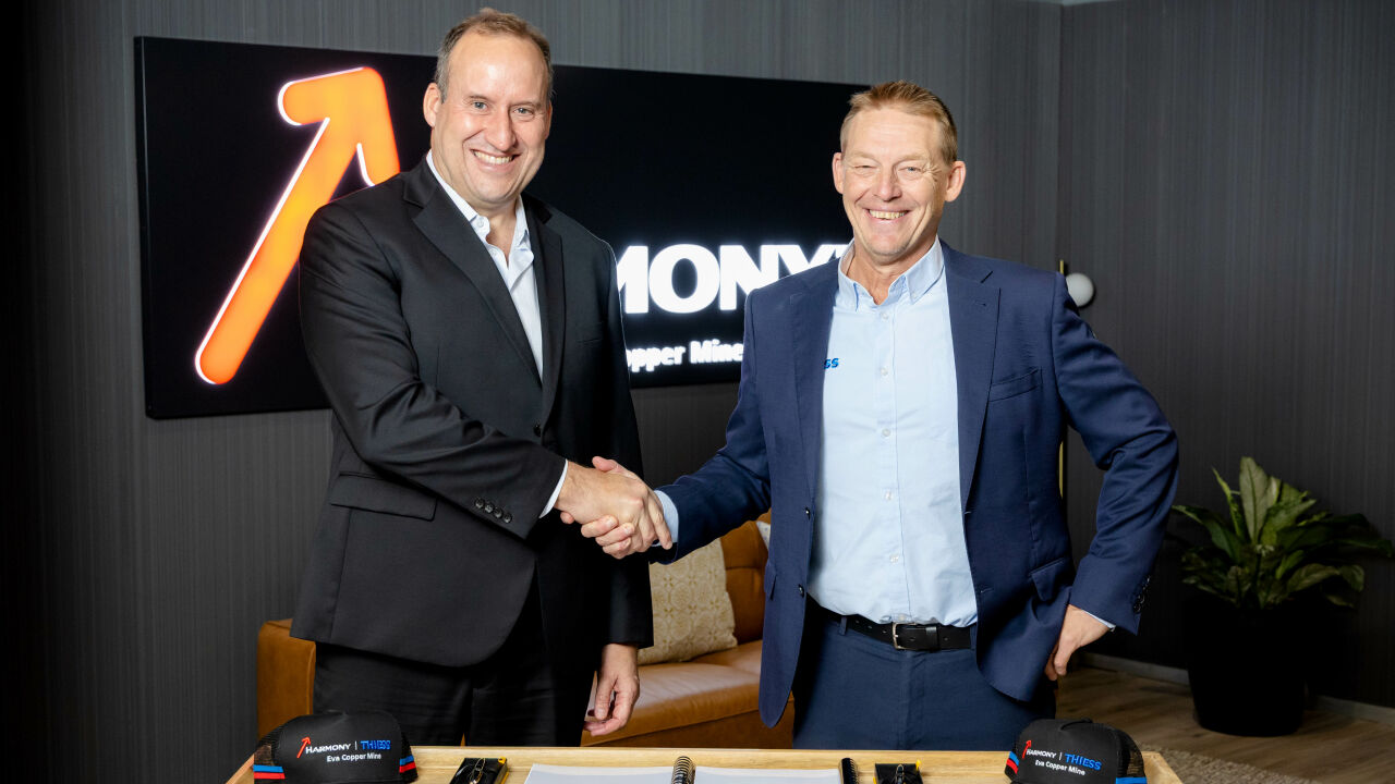 L-R: Harmony Chief Development Officer Johannes Van Heerden and Thiess Group Executive Chair and CEO Michael Wright  formalise a $700M alliance agreement to deliver mining services for the Eva Copper Mine in North Queensland.